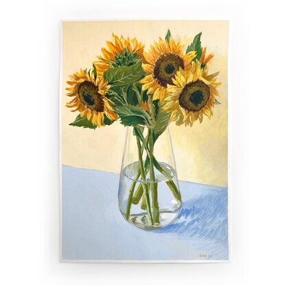 Large sunflower bouquet in glass vase