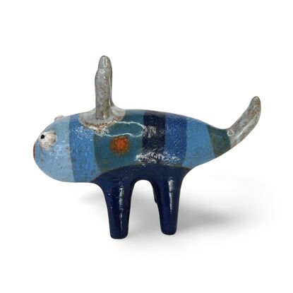 Here is a friendly little ceramic bug featuring a range of rich blue glazes.