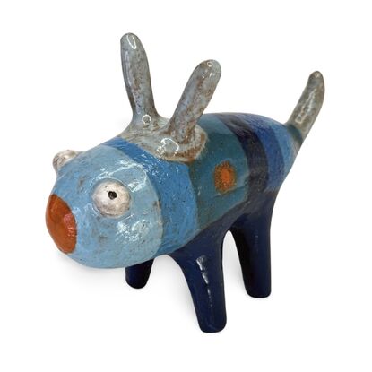 Here is a friendly little ceramic bug featuring a range of rich blue glazes.