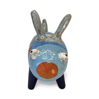 Here is a friendly little ceramic bug featuring a range of rich blue glazes.