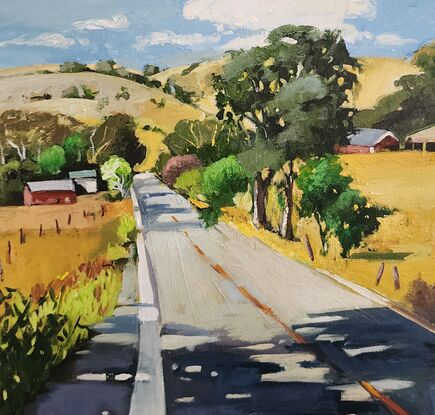 Rural Australian Landscape depicting a road with trees and rolling hills in the background.