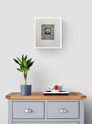 A single azalea bloom mounted on vintage paper