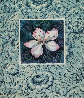 A single blossom mounted on vintage floral paper.