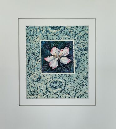 A single blossom mounted on vintage floral paper.