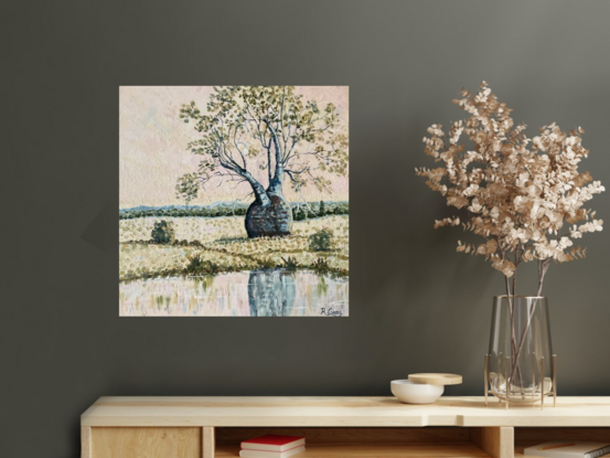 Bottle or boab tree in a rural setting with a light pink sky near a waterhole, with reflections in water. 