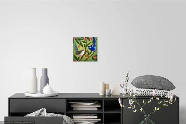 Two blue wrens, a male and a female, sitting in a tree surrounded by leaves and orange flowers. The background is a yellow-greenish colour which contrasts nicely with the blue of the birds and the orange flowers. The colour is wrapped around the sides of the canvas.