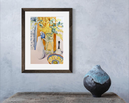 Inspired by the full bloom of glories wattle in my garden, this still life evolved with everyday objects. Including a bowl I bought in Venice and a glass jug that has become a vase. Pretty boy adds a touch of whimsy and fun to this vibrant still life. 