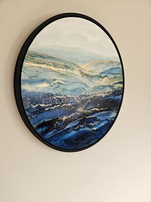 60cm round seascape of blues and green shades with quality black floating frame. 