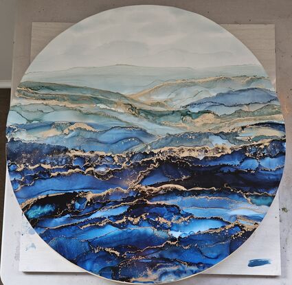 60cm round seascape of blues and green shades with quality black floating frame. 