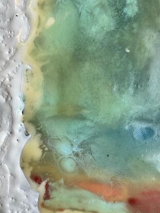 A straight red boardwalk cuts through layers of green and blue water and White Sea foam. A highly textured piece made with encaustic paint.