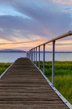 Timber jetty at sunset on Lake Colac