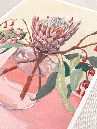 Protea and gum flowers in vase on pink background