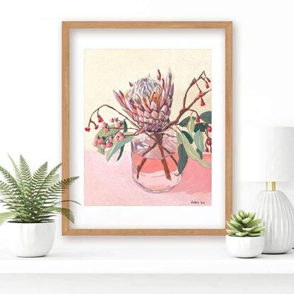 Protea and gum flowers in vase on pink background