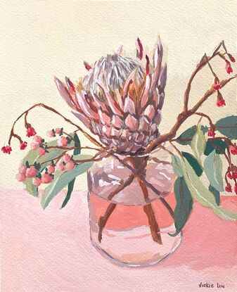 Protea and gum flowers in vase on pink background