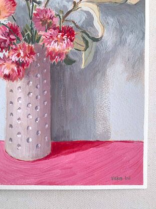 Pink daisy flowers and gum bouquet in white vase on pink background