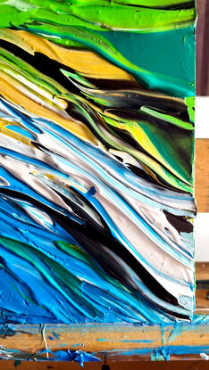 Dark blue colours with ocean rocks and a bay, green hills. Painted in expressive abstract strokes. 

