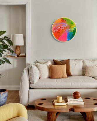 A circle shaped canvas with raw pine frame. 
A smaller artwork full of colour and neon brights. Bring joy to any room with this artwork. 