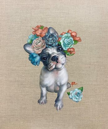 A grey and white French Bulldog puppy wearing a flower crown.