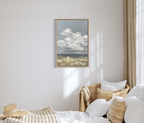 Lonely white shack on beach with puffy white clouds.