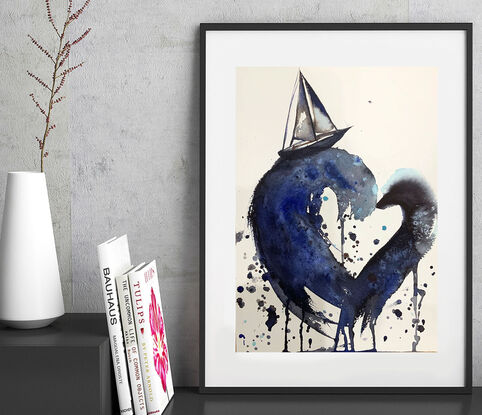 “My Sailing Heart” by Sydney artist Leni Kae is a watercolour seascape painting featuring large waves in a heart shape, with a sailboat on top; carrying symbolism of love, the search for love and new journeys of the heart. Indigo, deep blue, and light blue tones. 