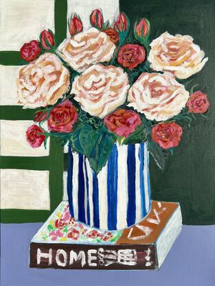 A home book with beautiful rose in the blue and white vase. 