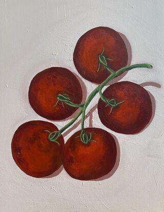 Ripe red tomato bunch on blush pink background 