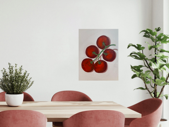 Ripe red tomato bunch on blush pink background 