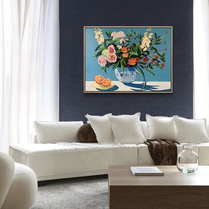 A still life painting of flowers and fruit in blues, reds, oranges, yellows, whites, pinks and greens, framed in oak