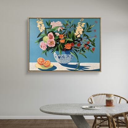 A still life painting of flowers and fruit in blues, reds, oranges, yellows, whites, pinks and greens, framed in oak