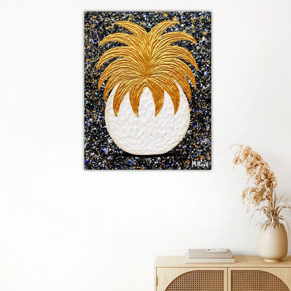 textured gold and white textured pineapple on a starry black background 