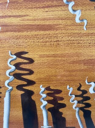 Cork screws  on wooden table dark shadows 