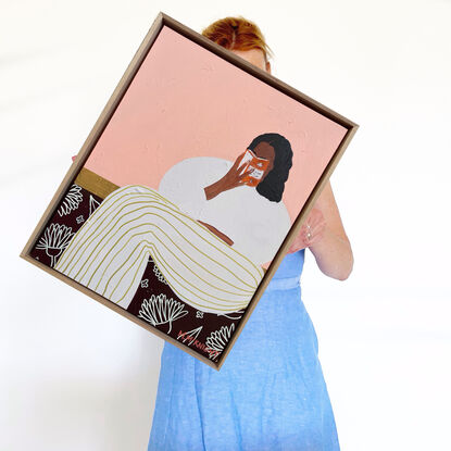 Pale background, woman reading book on face