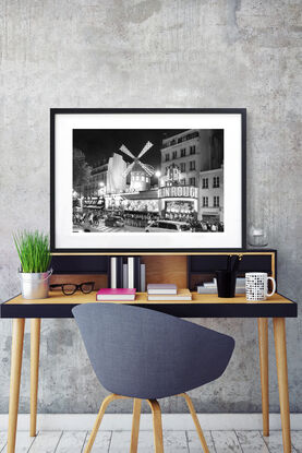 Black and white photograph of crowd outside Moulin Rouge Cabaret in Paris