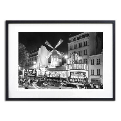 Black and white photograph of crowd outside Moulin Rouge Cabaret in Paris