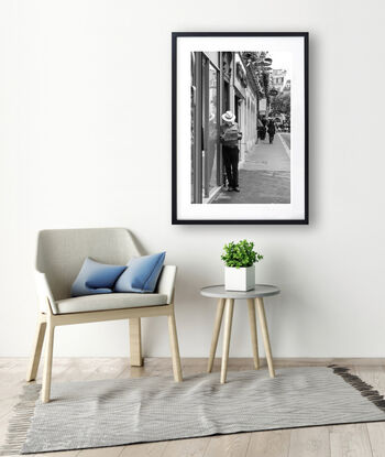 Black and white photograph of narrow street in Paris, France