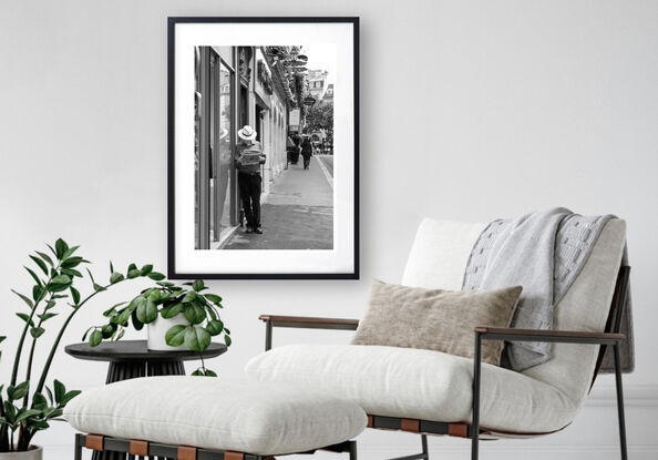 Black and white photograph of narrow street in Paris, France