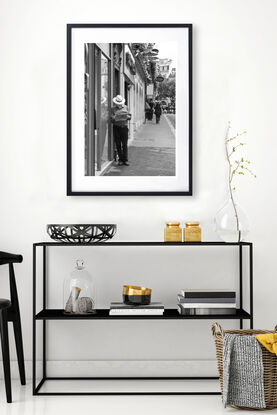 Black and white photograph of narrow street in Paris, France