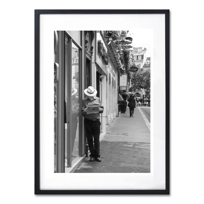 Black and white photograph of narrow street in Paris, France