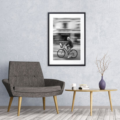 Black and white photograph of cycling in street Paris, France