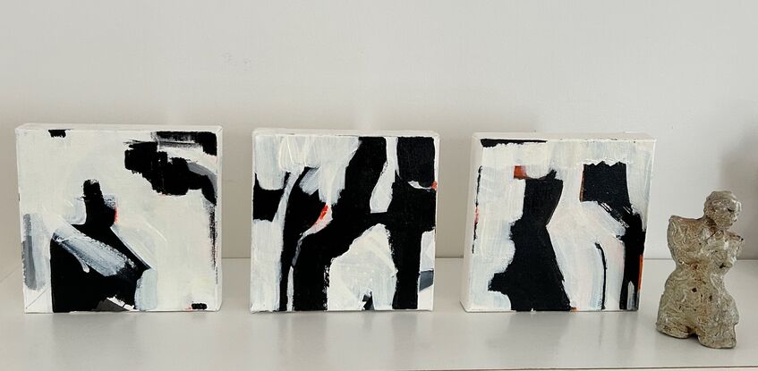 Three pieces black and white with orange.  Each piece  20 x 20 relates to each other and overall creates one art work.