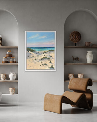 Pathway to the beach with soft pink hues and shadows in the sand dunes 
