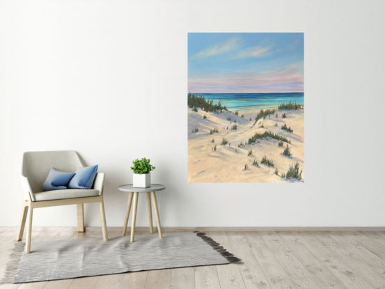 Pathway to the beach with soft pink hues and shadows in the sand dunes 
