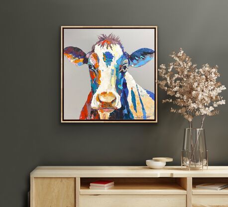 Portrai of a cow on a grey neutral background with pops of colour and texture. 