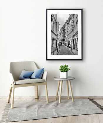 Black and white photograph of curved street in Paris, France