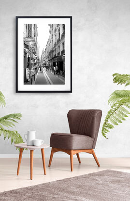 Black and white photograph of narrow street in Paris, France