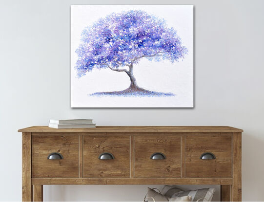 A thickly textured palette knife oil painting of a graceful Jacaranda tree with vibrant blue, lavender and purple foliage against a white painted background. 