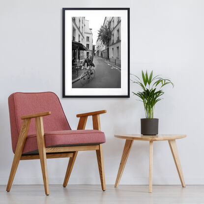 Black and white photograph of narrow street in Paris, France