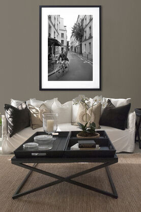 Black and white photograph of narrow street in Paris, France