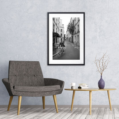 Black and white photograph of narrow street in Paris, France