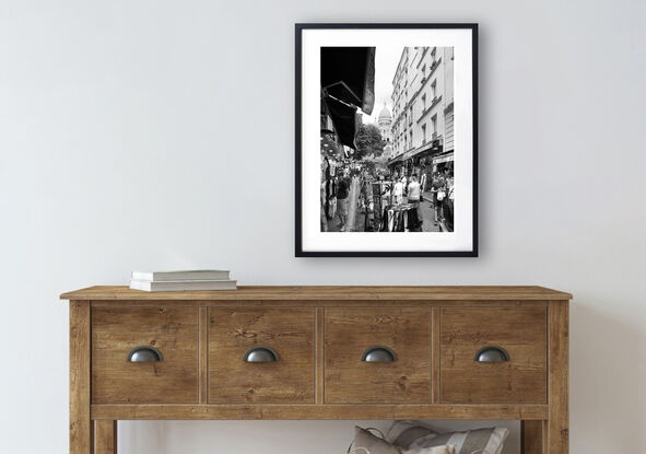 Black and white photograph of narrow street in Paris, France